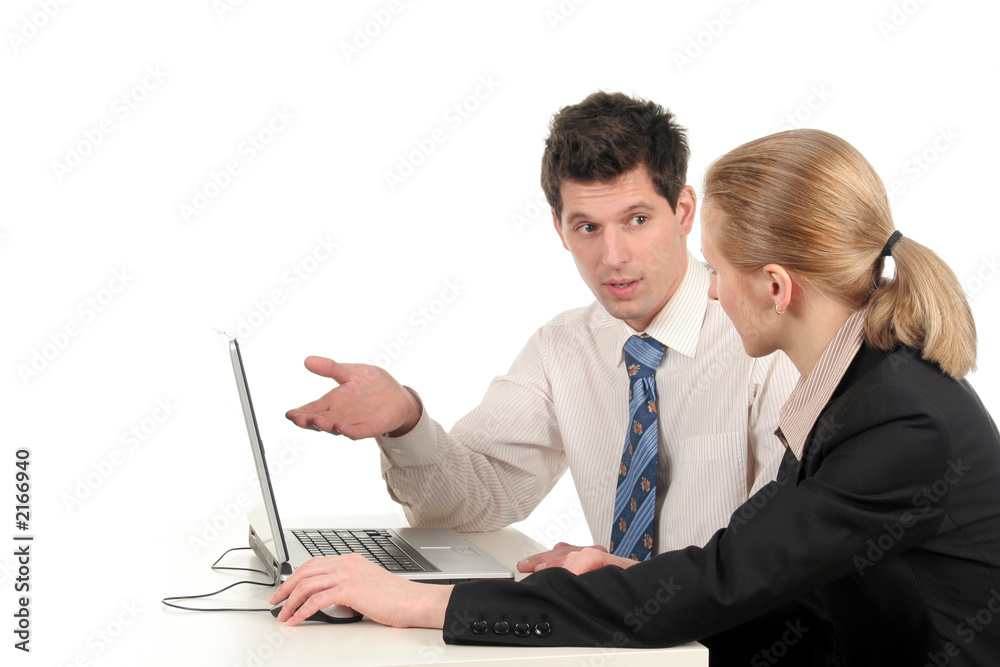 businesswoman and businessman sitting at desk with businesswoman and businessman sitting at desk with