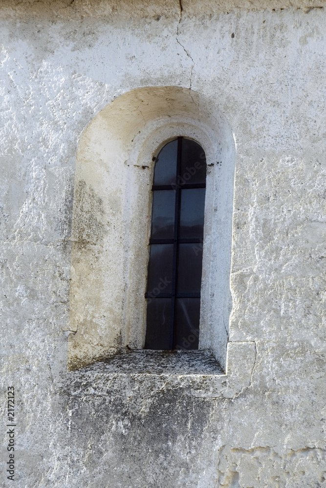 window on stone wall