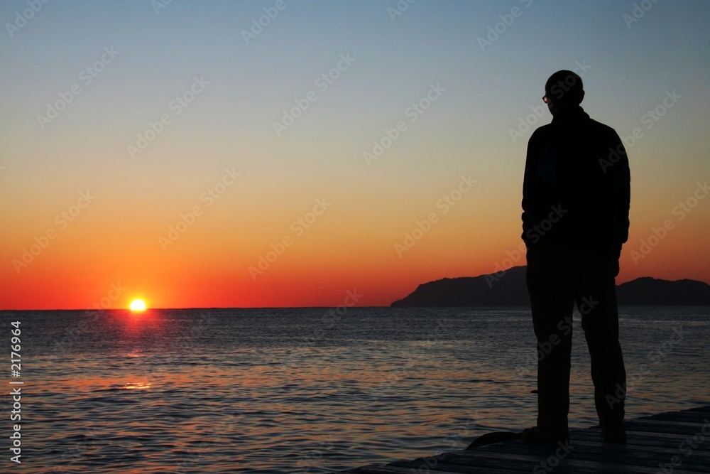 man looking on sunset