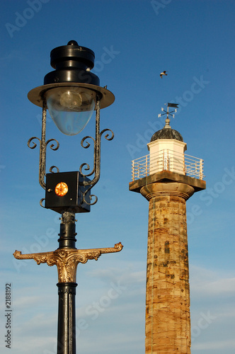 street lamp and lighthouse photo