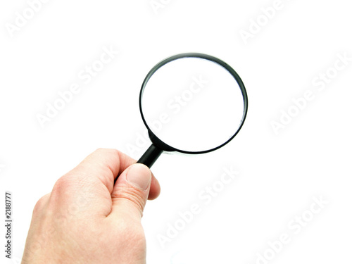 hand with magnifying glass