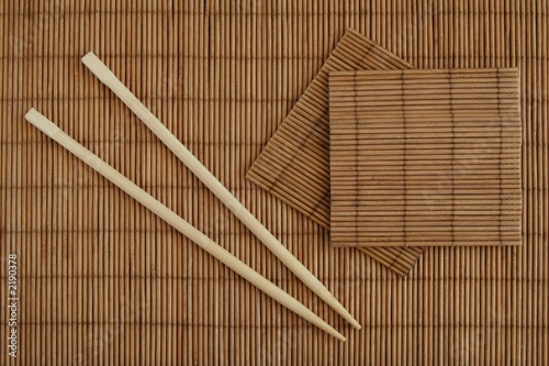 chopsticks and bamboo mat