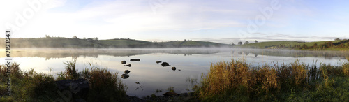 misty autumn sunrise on an irish lake