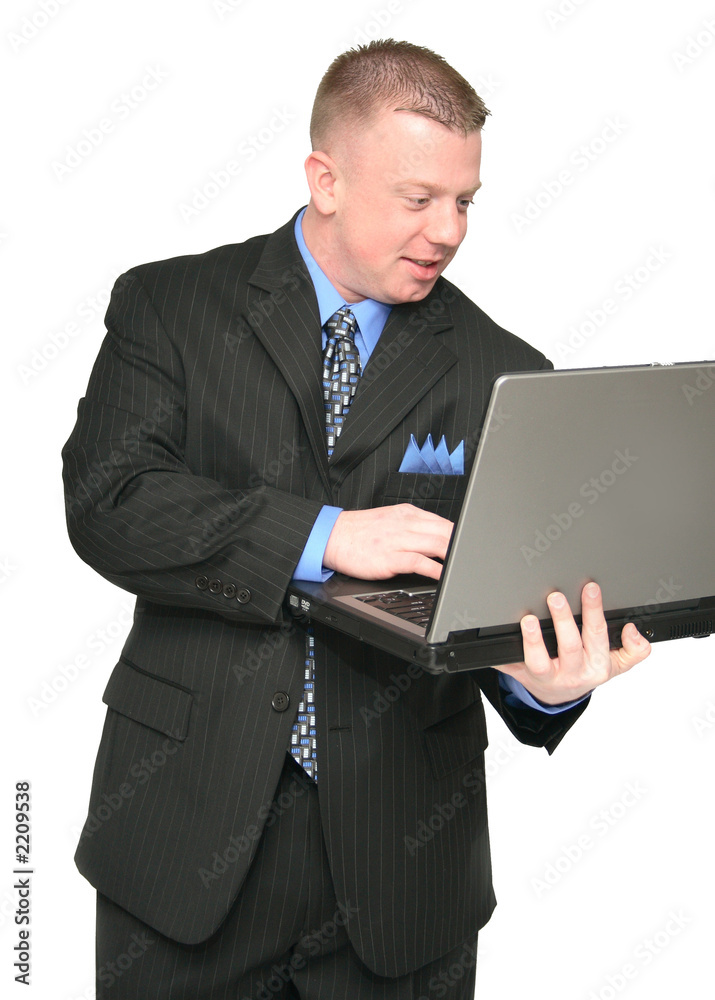 business man holding a laptop computer business man holding a laptop computer