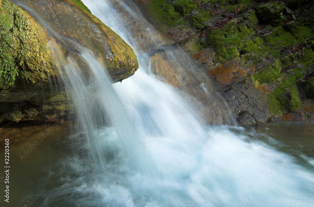 Fototapeta premium waterfall and large stone