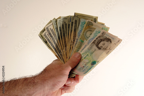 miscellaneous currency in male hand
