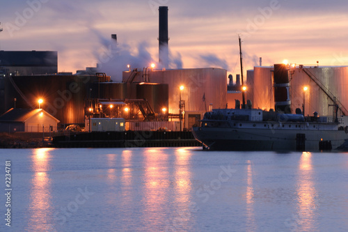 cargo ship dockside of industrial plant