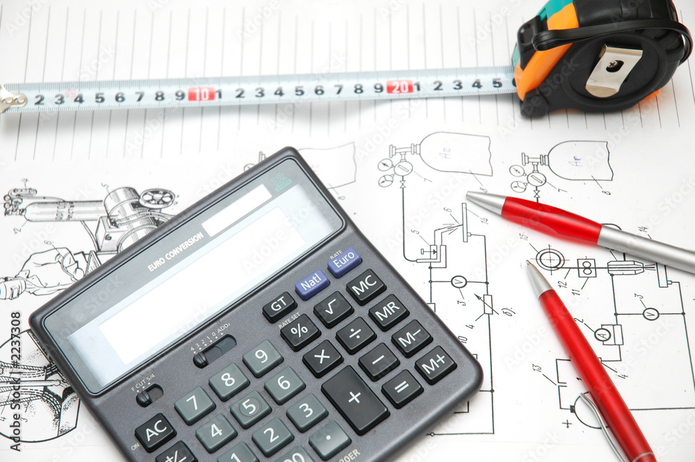design drawings, calculator, pens and measuring ta design drawings, calculator, pens and measuring ta