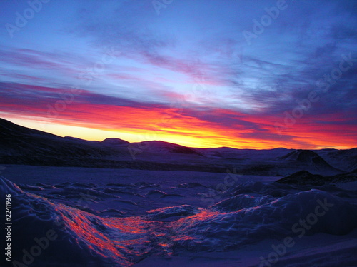 sunrise above ice mountains of altai