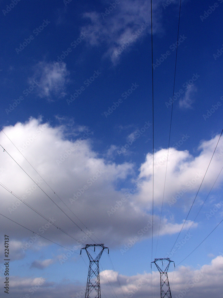 electricity towers with clouds