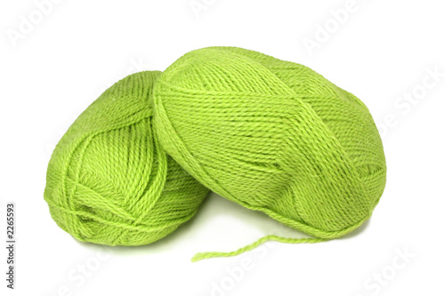 two skeins of green wool yarn.