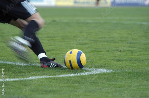 the football goalkeeper beats out a ball
