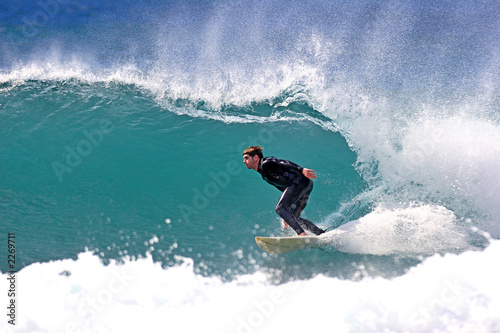 surfer executing a bottom turn