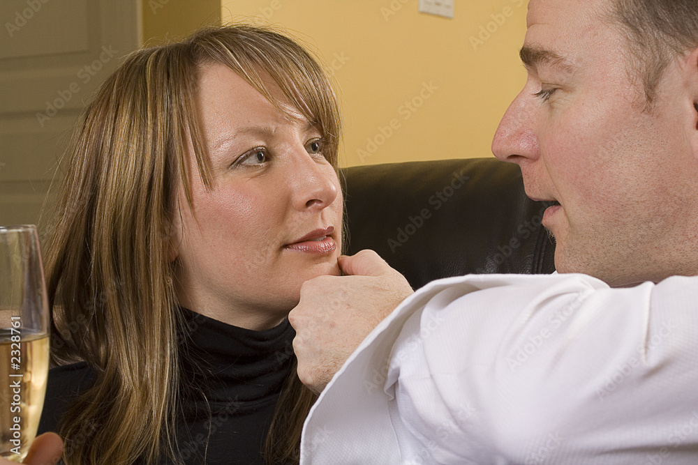 Fototapeta premium happy couple flirting on couch