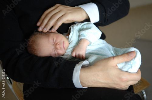 father and newborn son photo