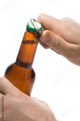 person opening a bottle of beer