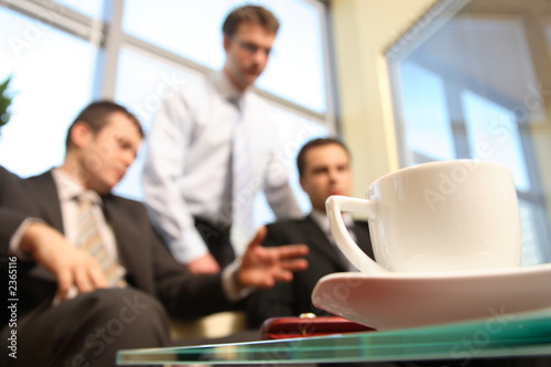 young business men talking in an office -blur