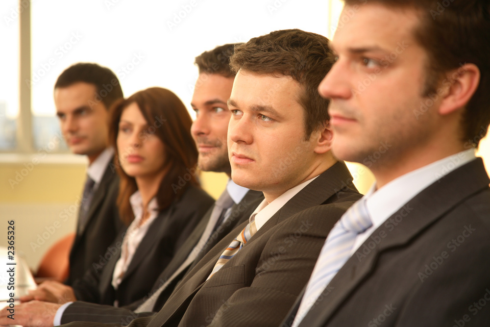 group of business persons at a conference, man in group of business persons at a conference, man in