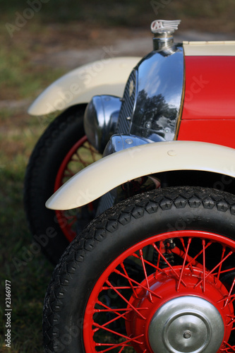 detail of classic british car wheel, headlight and