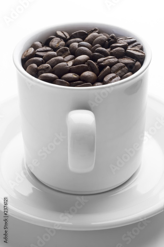 coffee cup full of coffee beans