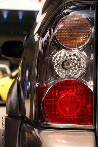 Car hedlight close-up. Turn, stop and reverse signals.