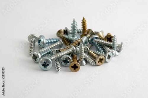 several screws in metal and cobber. photo