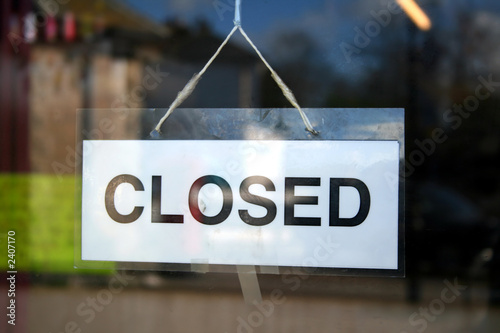 a closed sign in a shop window. photo