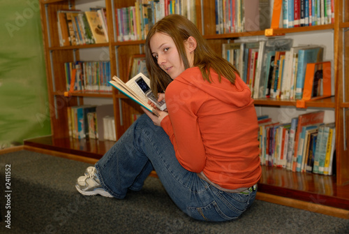 teenager in library 2 with cell phone