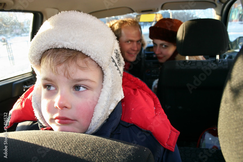 Photography sad boy in winter family car