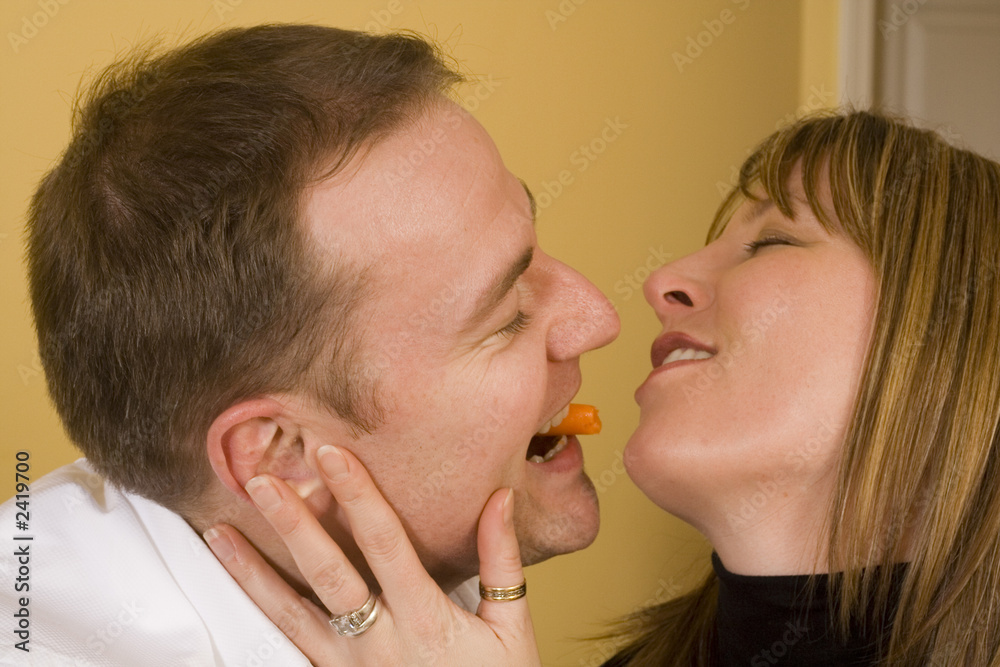 happy couple cooking and kissing happy couple cooking and kissing