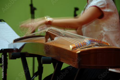 musican playing chinese stringed  musical instrument
