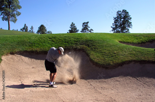 golfer hitting out of a sand trap (2 of 3 shot act