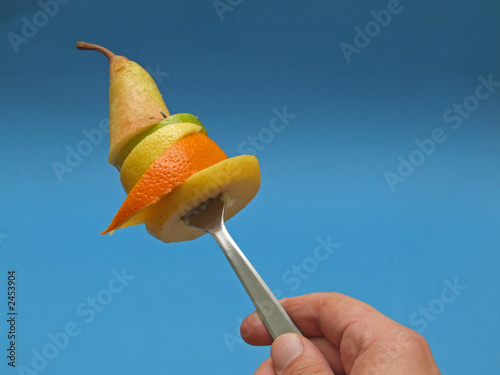 sliced fruits on fork
