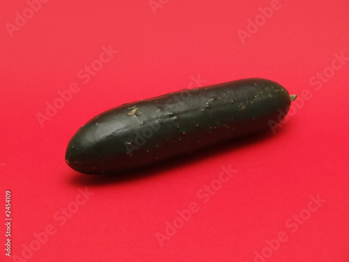 fresh cucumber on red background