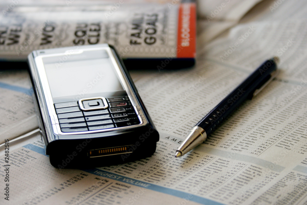 mobile, newspaper and pen mobile, newspaper and pen
