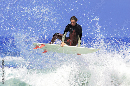 a surfer executing an ariel maneuver