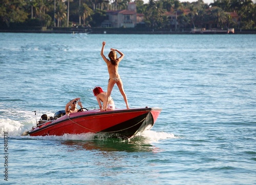 topless on a speed boat photo