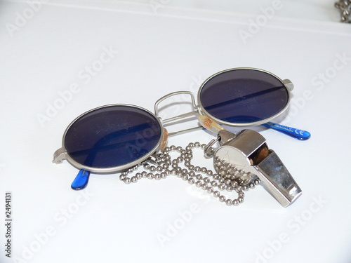 a pair of blue sunglasses with a metal whistle