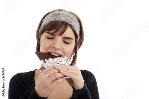 young woman eating chocolate