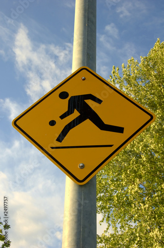 kids playing street sign