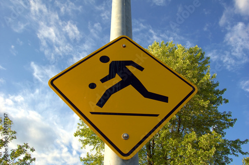 kids playing street sign