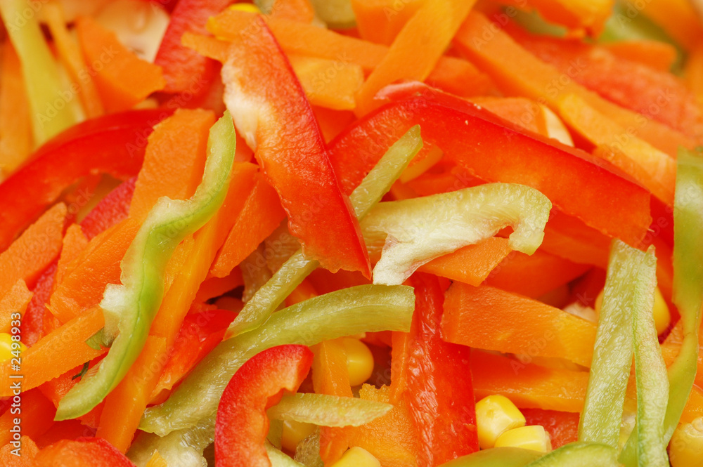 background with shredded red and green peppers background with shredded red and green peppers