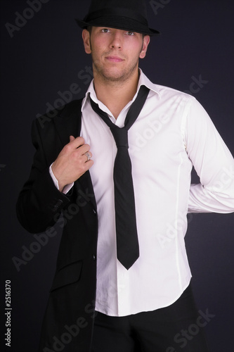 man in hat and suit