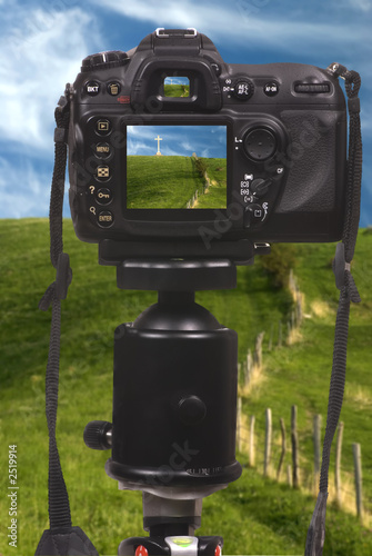 digital camera dslr on tripod photo