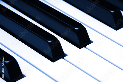 piano keys closeup, colorized blue
