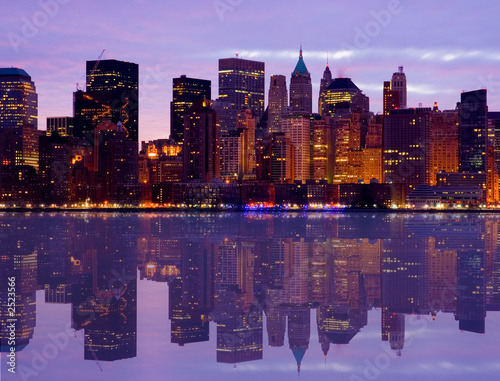 early morning manhattan skyline with water reflect