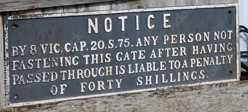 old railway crossing notice sign