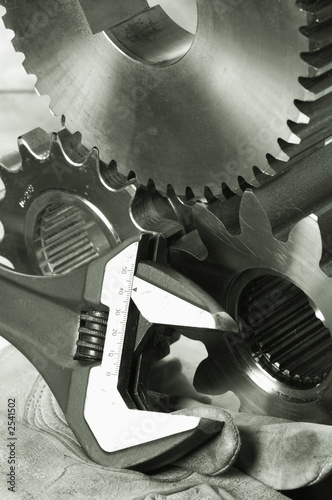 wrench, gears and glove in duplex-bronze toning photo