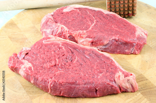 steaks on a chopping board