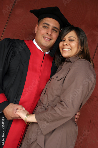 happy graduate with his partner photo